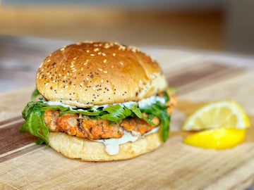 EMPLOYEE FAVORITE! SALMON BURGERS WITH GARLIC LEMON AIOLI + ARUGULA