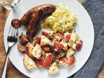 BRATWURST WITH GRAINY MUSTARD POTATO SALAD + GARLIC DILL SAUERKRAUT